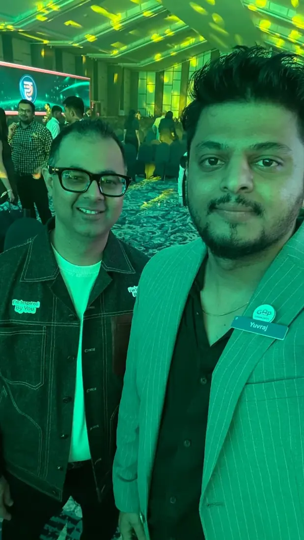 Yuvraj with a fellow attendee in the main hall at Proficorn 2025