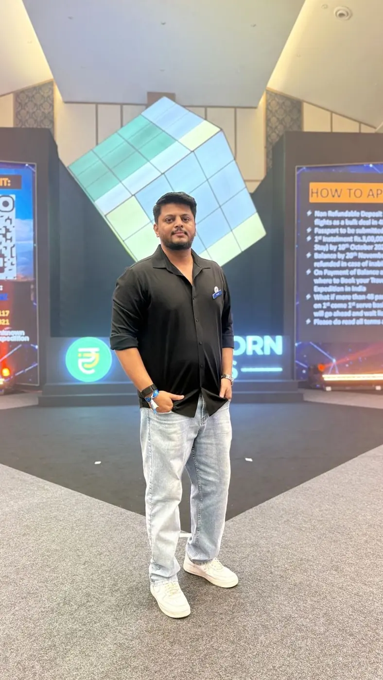 Yuvraj in front of the Proficorn stage cube in Bengaluru