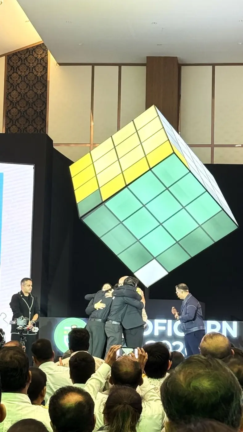 Award winners embracing on stage at Proficorn 2026